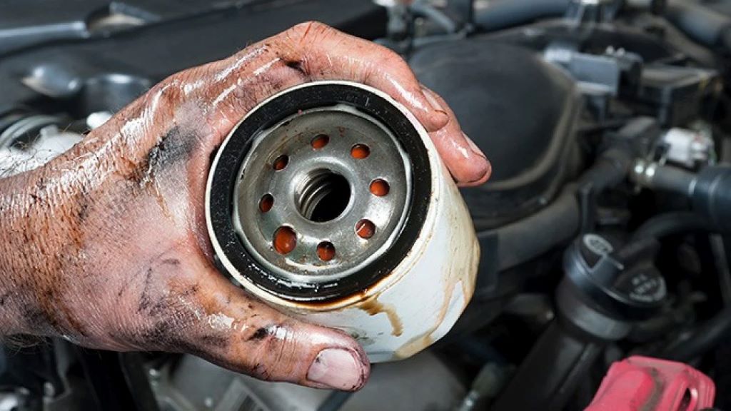 What are the steps to changing an oil filter