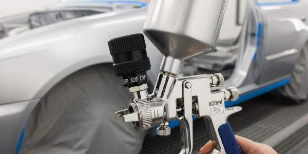 HVLP spray gun with gravity feed cup for automotive painting projects