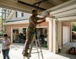 Homeowner in Atlanta testing garage door balance safely inside residential garage