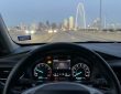 Dallas driver checking engine warning light with diagnostic scanner