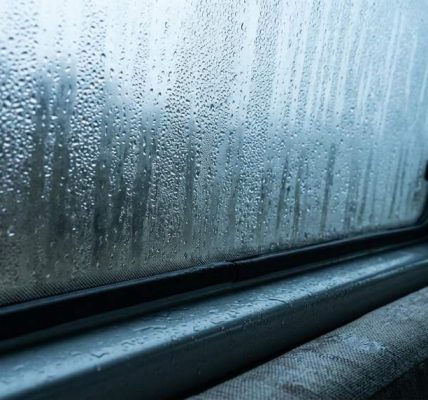 Van window covered with condensation during a rainy Seattle morning
